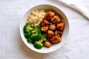 healthy teriyaki chicken bowl with broccoli and brown rice