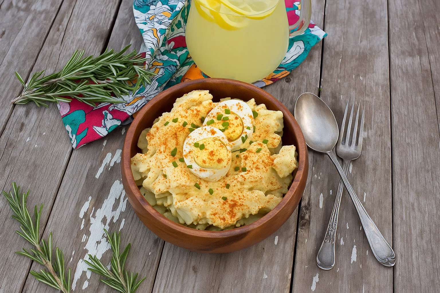 deviled egg potato salad on a wooden table